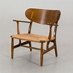 HANS J WEGNER, a CH 22 lounge chair. - Bukowskis