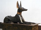 Statue of Anubis in Jackal form on top of an portable shrine. Picture ...