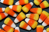 File:Candy corn strewn on a black background.jpg - Wikimedia Commons