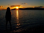 girl-staring-across-the-lake-into-the-sunset image - Free stock photo ...