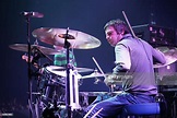 Chris Sharrock of Oasis performs on stage at the Heineken Music Hall ...