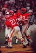 Gloster Richardson and Otis Taylor celebrate with Mike Garrett ...