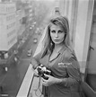 American model and actress Donna Michelle using a Pentax camera, 30th ...