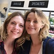 two women are taking a selfie in front of the camera at a wine shop
