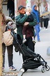Rupert Grint carries his daughter Wednesday during a stroll in New York ...