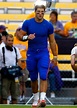 Quarterback Tim Tebow #15 of the Florida Gators warms up on the field ...
