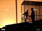 Cameraman's silhouette broadcasting live from a stadium Stock Photo - Alamy