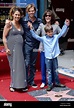 Actress Sally Field holds up the hands of her grandson Noah Craig as ...