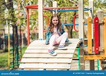 Little Girl Playing on a Playground Ladder Stock Photo - Image of ...