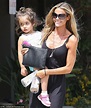 Denise Richards reveals glowing tan in LBD carrying daughter Eloise ...
