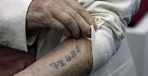 auschwitz-survivor-showing-identification-tattoo - Remembering the ...
