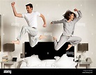 couple leaping out of bed Stock Photo - Alamy