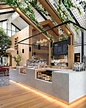 Una cafetería moderna diseñada con madera, vegetación y vidrio para que ...