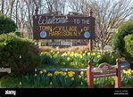A sign welcomes visitors to the town / village of Harrison, New York ...