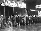 A line of men wait outside a soup kitchen opened during the depression ...