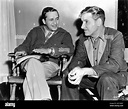 Director MERVYN LeROY and RONALD COLMAN on set candid during filming of ...