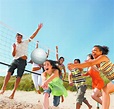 Group Of Teenage Friends Playing Volleyball On Beach | Chippers Lanes