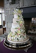 White Wedding Cake Cascading Flowers / White round 4 tier wedding cake ...