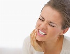 Portrait of young woman with toothache | Body One Physical Therapy