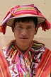 This young man is wearing the traditional dress of the Quechua people ...
