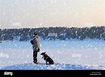 man with black dog. xtreme tourism, survival concept Stock Photo - Alamy