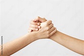 Two hands holding each other strongly Stock Photo | Adobe Stock