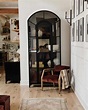 Black Arched Bookcase Cabinet Beside Gallery Wall - Soul & Lane