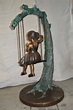 Girl on Swing 65 Bronze Statue - Size: 44"L x 35"W x 65"H. - NiFAO