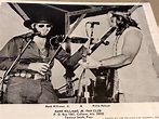 Hank Jr with Willie Nelson performing in 1976. | Hank williams, Willie ...