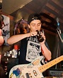 Young Billie Joe Armstrong smoking a makeshift bong on stage at what is ...