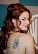 Alexandra Breckenridge's Tattoos - Lettering Tattoo on Upper Back ...