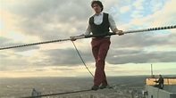 Amazing tightrope walker balances 300 metres up - YouTube
