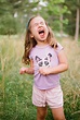 "Cute Young Girl Making A Funny Face In A Field" by Stocksy Contributor ...