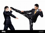 Two businessmen fighting on white background Stock Photo - Alamy