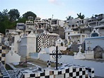 a cemetery with black and white tiles on the ground