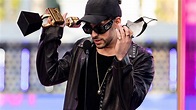 Benito Antonio Martínez Ocasio Rapper With Award Is Wearing Black ...