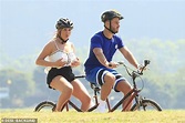 Charlotte Crosby cups her ample bust as she enjoys bike ride in Brazil ...