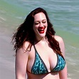 prompthunt: Kat Dennings relaxing on the beach wearing a bikini and ...