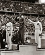 Jesse Owens saluting after winning gold in the 1936 Olympic men’s long ...