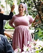 Pregnant Kelly Osbourne debuts baby bump in pink dress: pics