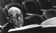 Igor Stravinsky wearing two pairs of glasses while reading musical ...