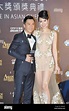 Hong Kong actor Donnie Yen, left, and his model wife Cecilia Wang pose ...