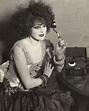 Broadway star Lenore Ulric listening to an early radio receiver (1922 ...