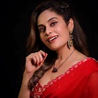 "Crimson Charisma": Shrutika Arjun Sizzling in Red Saree mood