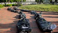 Protesters lay body bags near White House