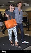 Milla Jovovich y su marido Paul Anderson en el Aeropuerto Internacional ...