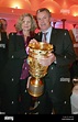 Coach Ottmar Hitzfeld and wife Beatrix pose with the DFB-Trophy during ...