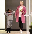 Charlize Theron models a pink coat over with her daughter August in Los ...