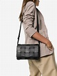 Bottega Veneta black Cassette leather shoulder bag | Browns