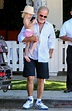 Kelsey Grammer carries daughter Faith on day out with wife Kayte and ...